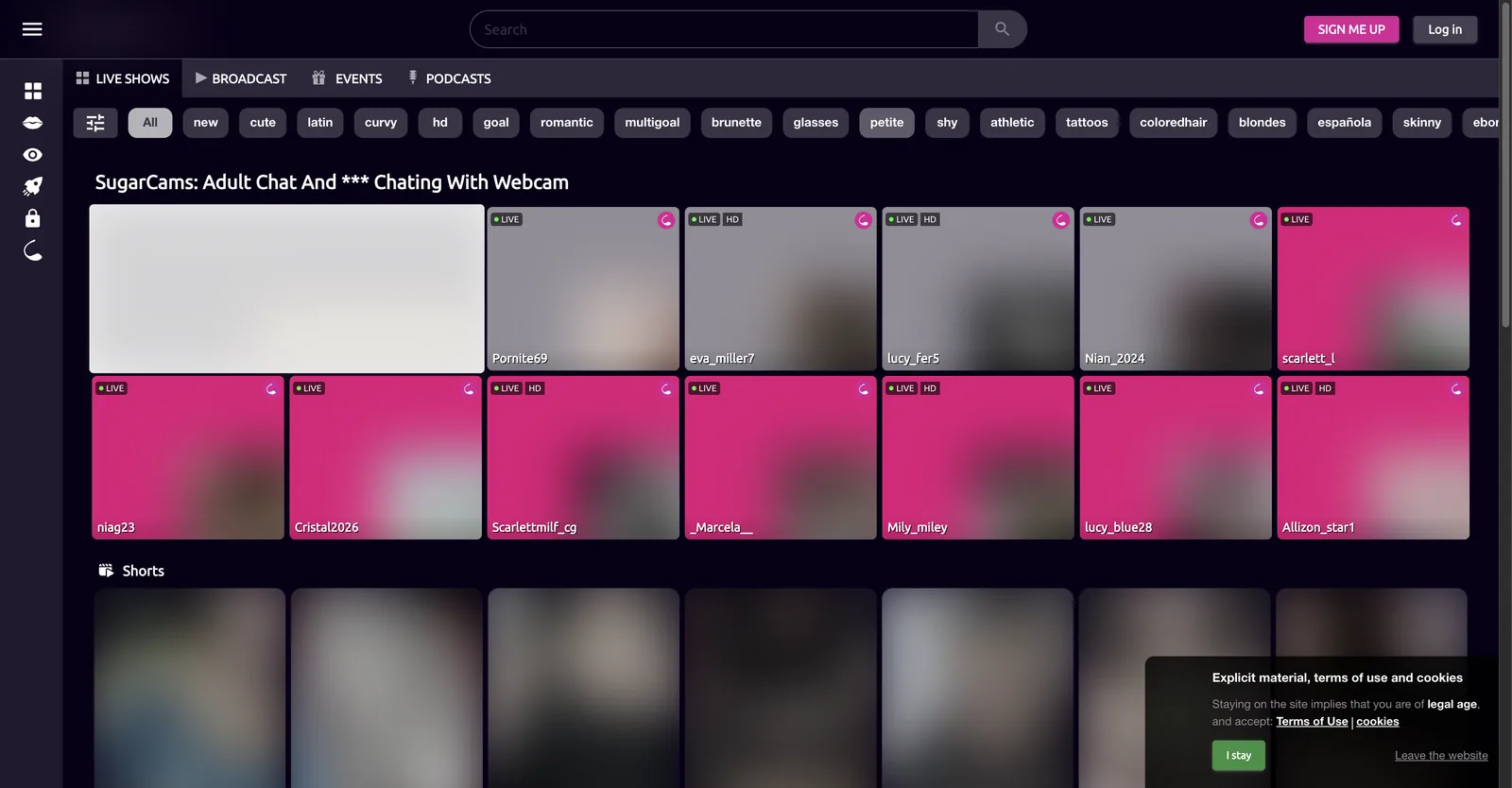 SugarCams home page with a dark purple grid of room tiles, a tag strip along the top and an explicit material consent panel in the corner