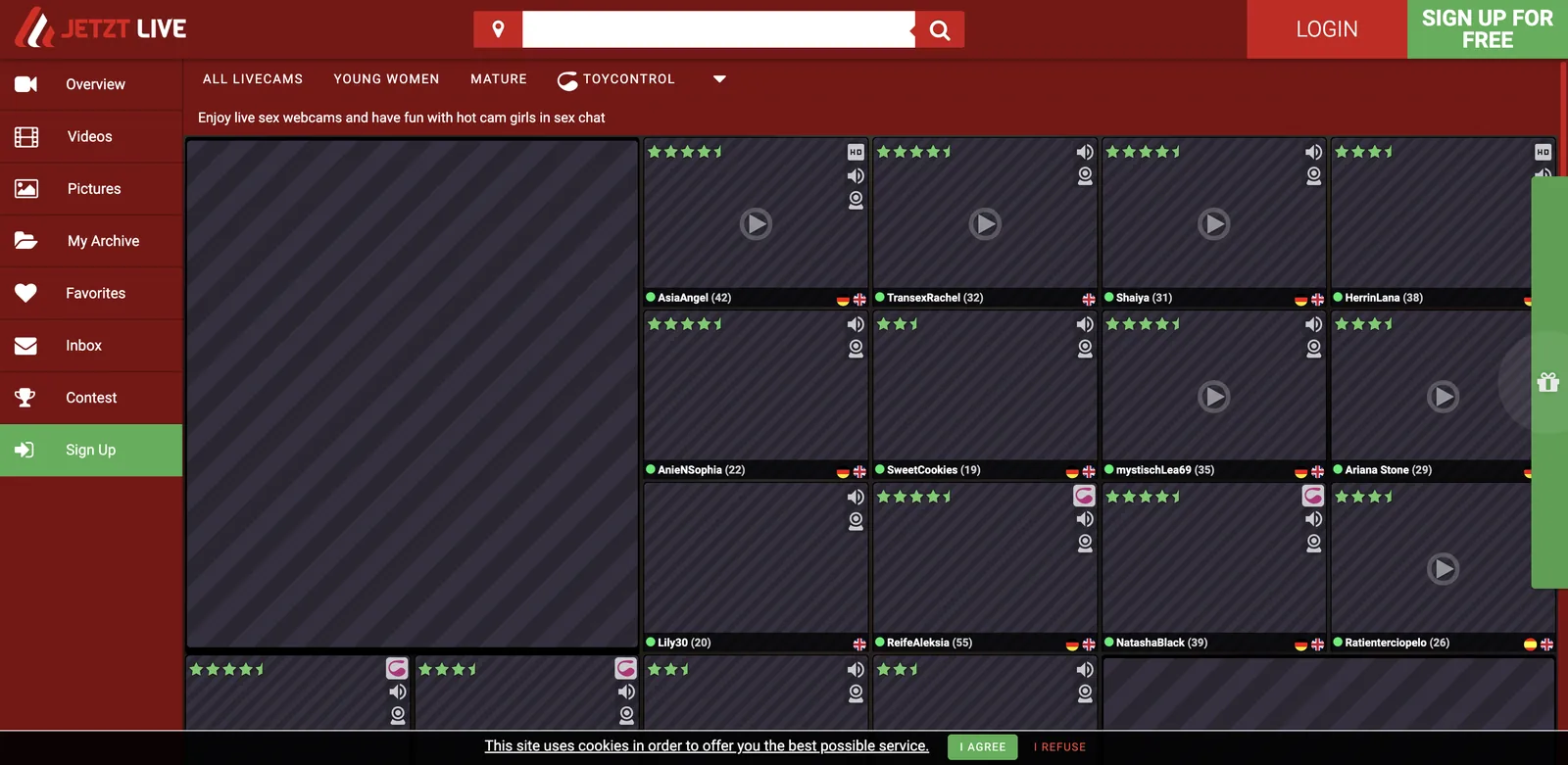 JetztLive grid with a left navigation of overview, videos, pictures, archive, favorites, inbox and contest, four category tabs reading all livecams, young women, mature and toycontrol, above tiles each carrying a varying star rating, an online dot, a name, an age, language flags and feature badges